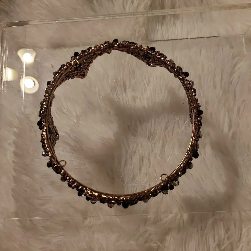 A full round tiara worn twice has 2 stones missing, beautiful!!!